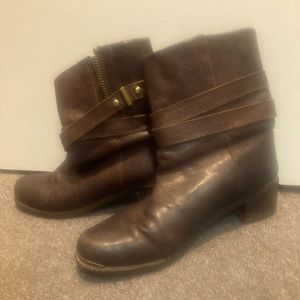 Brown leather boots with brass hardware